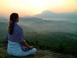 womenmeditatingsunset