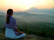 womenmeditatingsunset